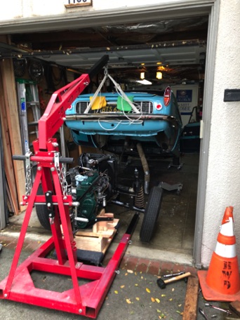 Frame lifted to clear the top of the engine and radiator